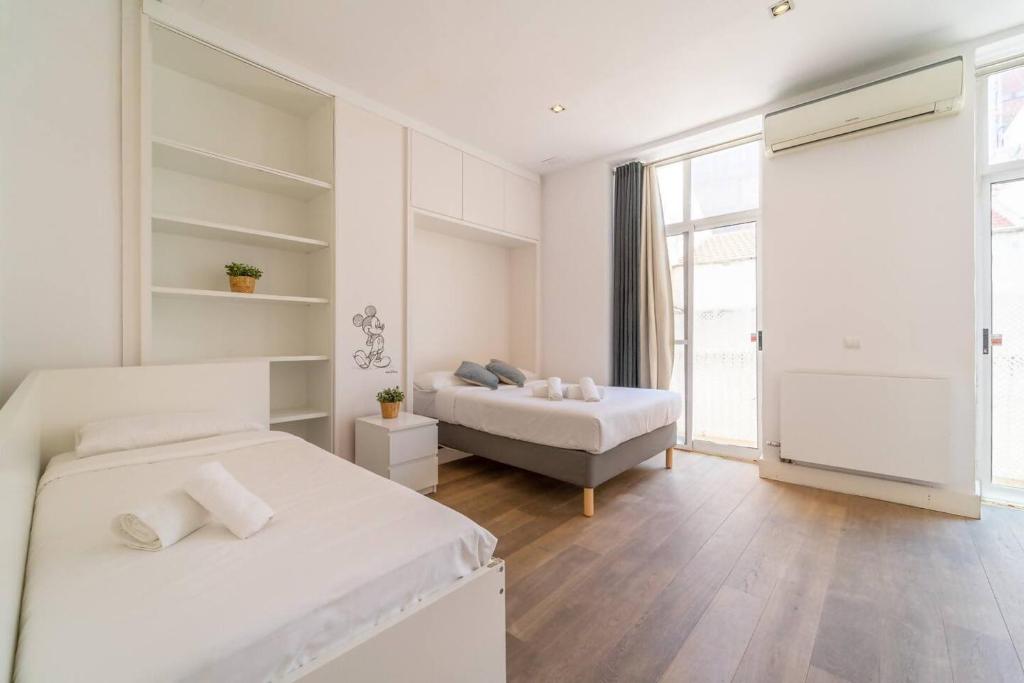 Posteľ alebo postele v izbe v ubytovaní LovelyLoft Altamira Duplex