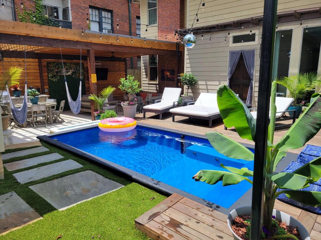 a backyard with a pool with a frisbee in it at The Classy Craftsman - Beautiful Decor & Pool in Atlanta