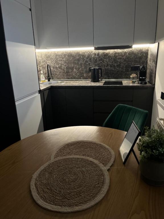 Kuchyň nebo kuchyňský kout v ubytování IQ Apartments