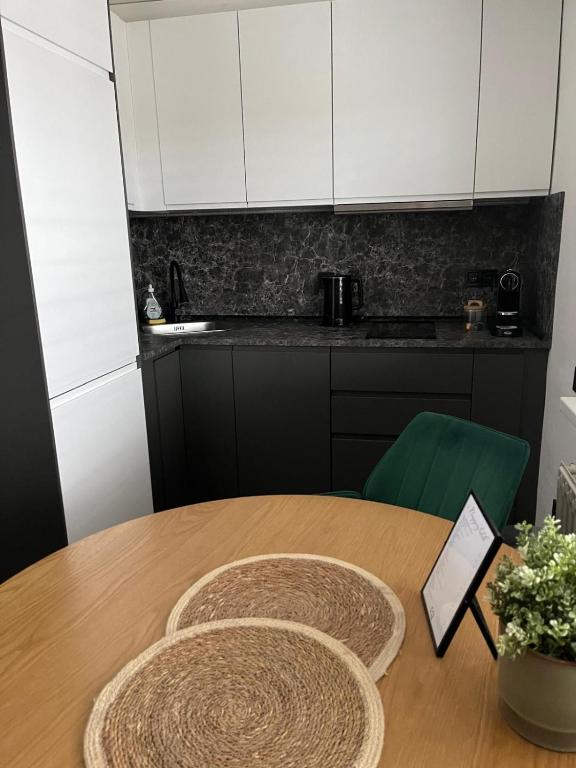 Kuchyň nebo kuchyňský kout v ubytování IQ Apartments