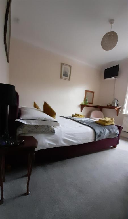 Postel nebo postele na pokoji v ubytování Hygge Somerset