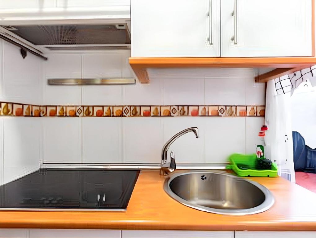 Kuchyň nebo kuchyňský kout v ubytování Cosy apartment in the heart of Madrid, 45m², with A/C