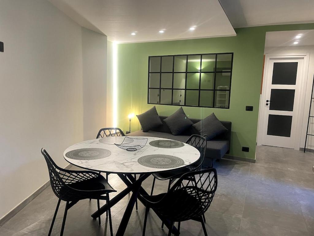 a living room with a table and a couch at COURT HOUSE Baveno Lake in Baveno