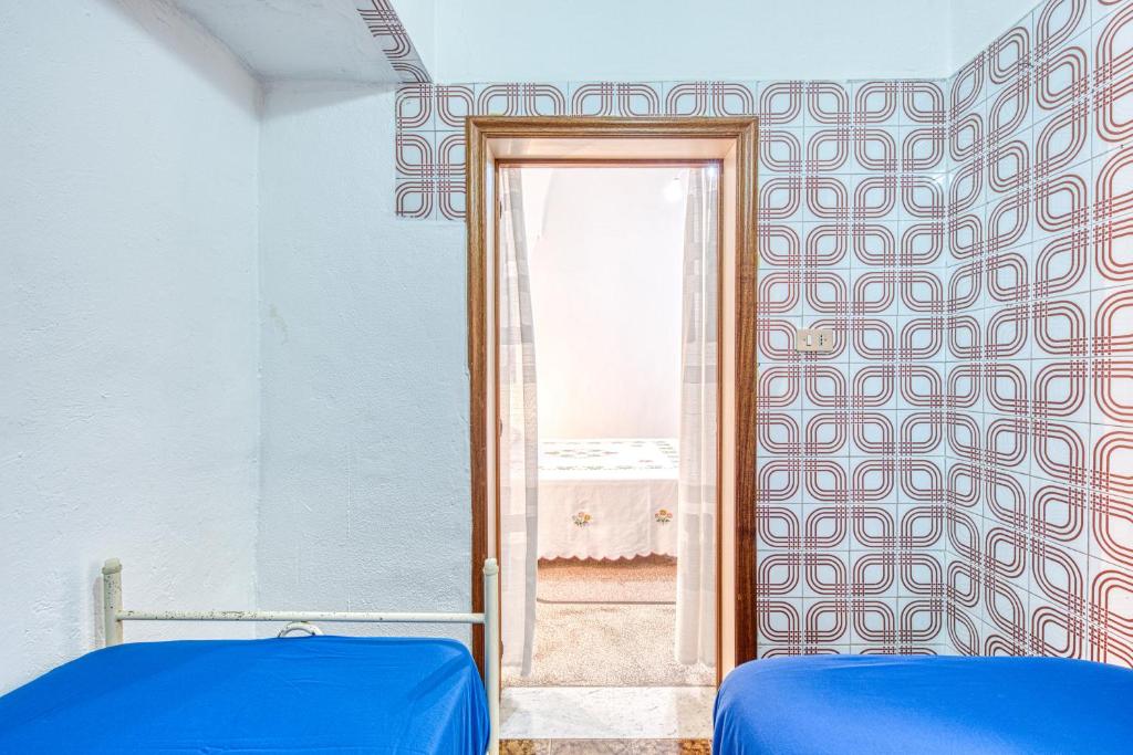 Łóżko lub łóżka w pokoju w obiekcie Cod 278 al centro del paese