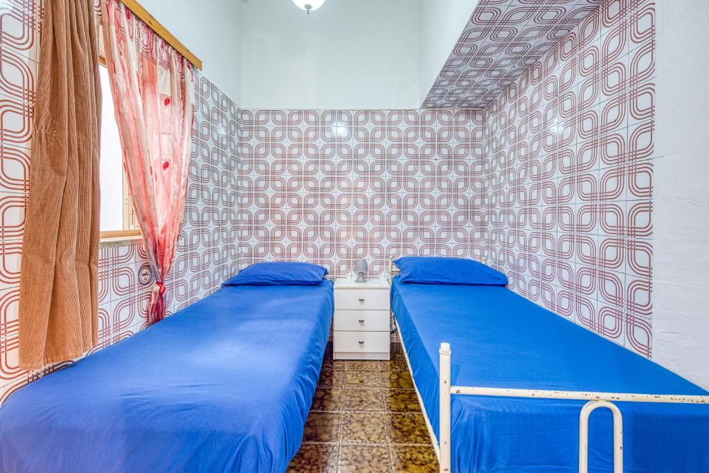 Łóżko lub łóżka w pokoju w obiekcie Cod 278 al centro del paese
