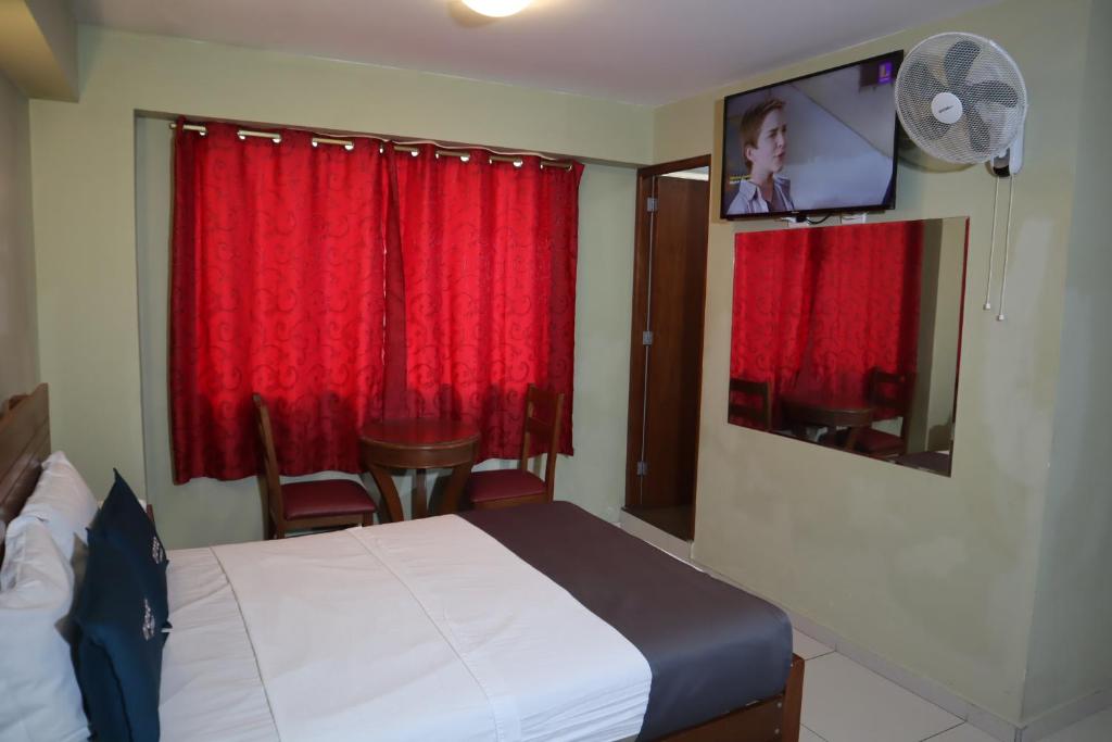 Postel nebo postele na pokoji v ubytování Hostal ISIS