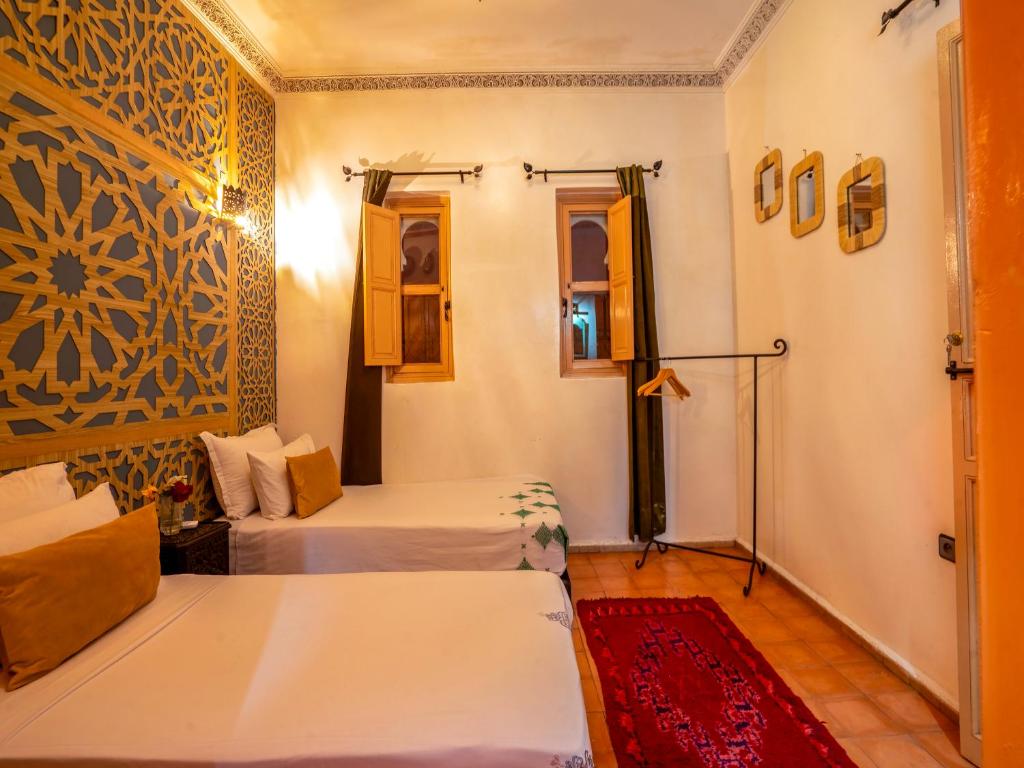 Postel nebo postele na pokoji v ubytování Riad Dar Nakhla
