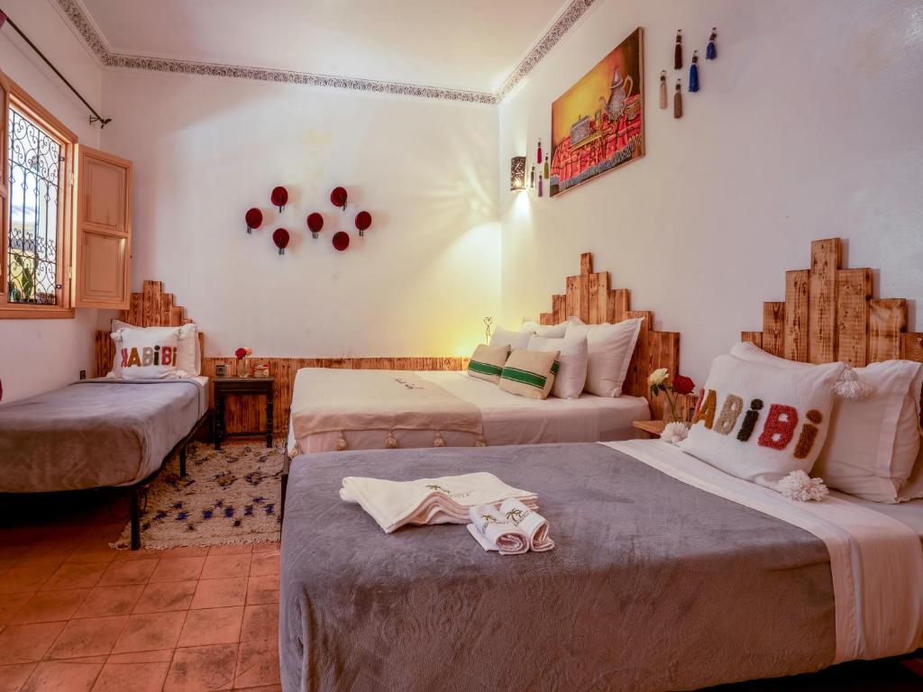 Postel nebo postele na pokoji v ubytování Riad Dar Nakhla