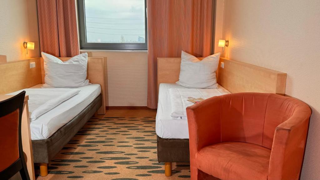 Hotel Rhein-Ruhr Bottropにあるベッド