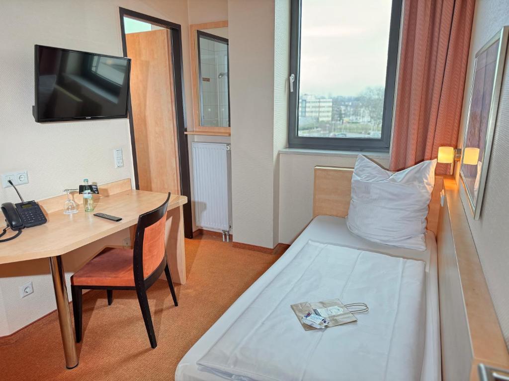 Hotel Rhein-Ruhr Bottropにあるベッド
