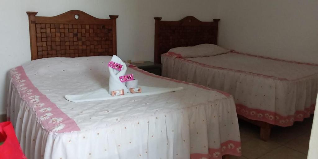 Postel nebo postele na pokoji v ubytování La Sirenita