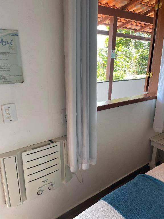 Postel nebo postele na pokoji v ubytování Suites Casa Azul-Vila do Abraão- conforto, limpeza, ótima localização