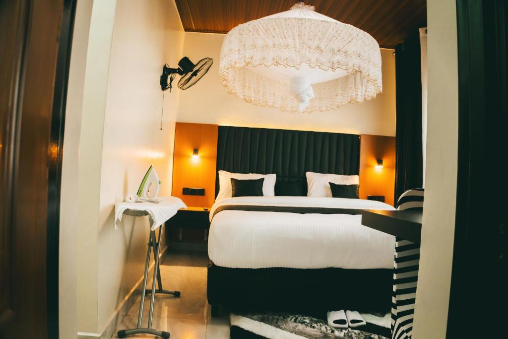 Postel nebo postele na pokoji v ubytování One Click Apartment