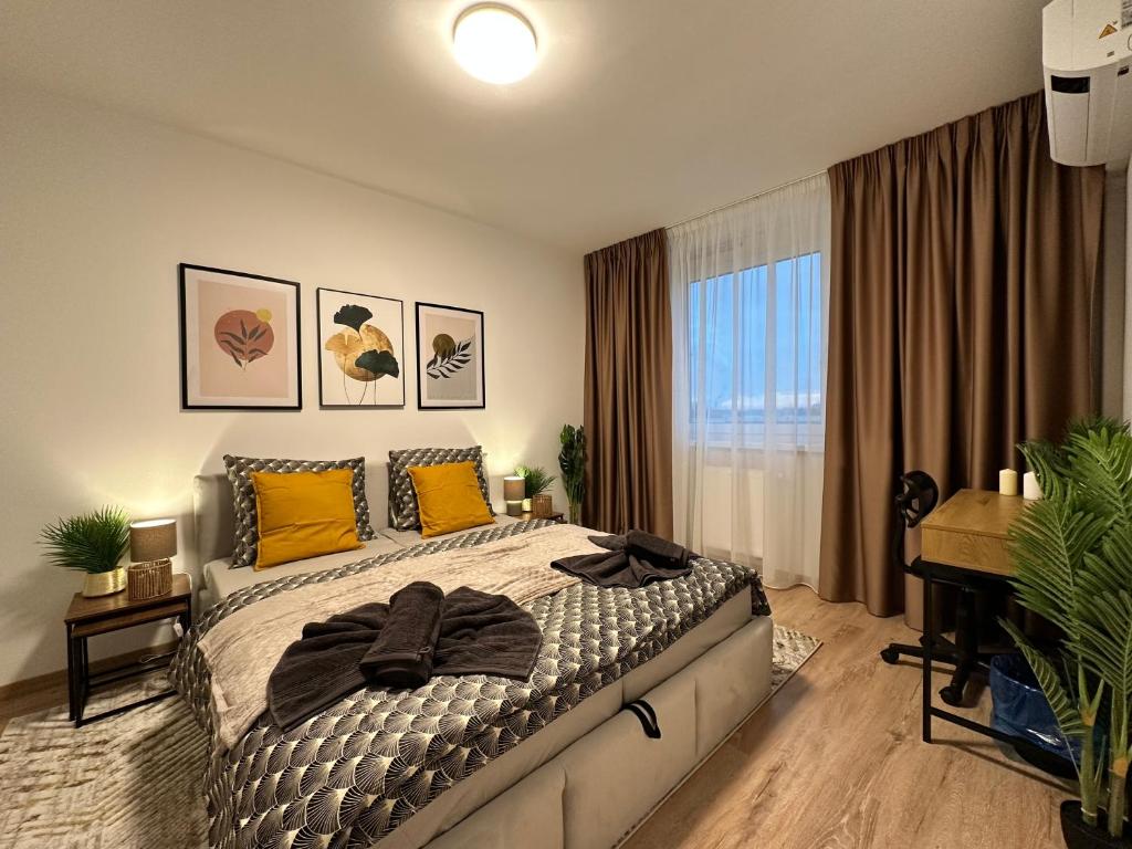 a bedroom with a bed with yellow pillows and a window at Nuppu1, free parking, self check-in in Trnávka