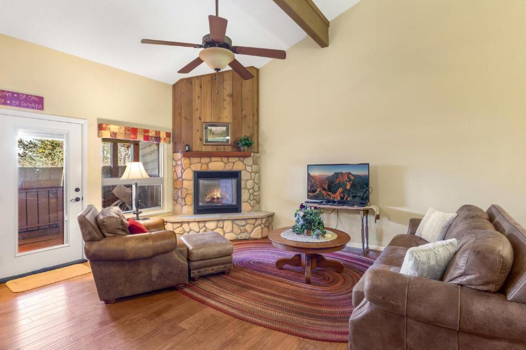 a living room with two couches and a fireplace at Causeway 3026 in Pagosa Springs