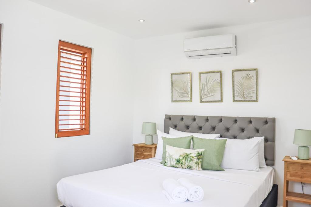 Postel nebo postele na pokoji v ubytování Sapphire Residence