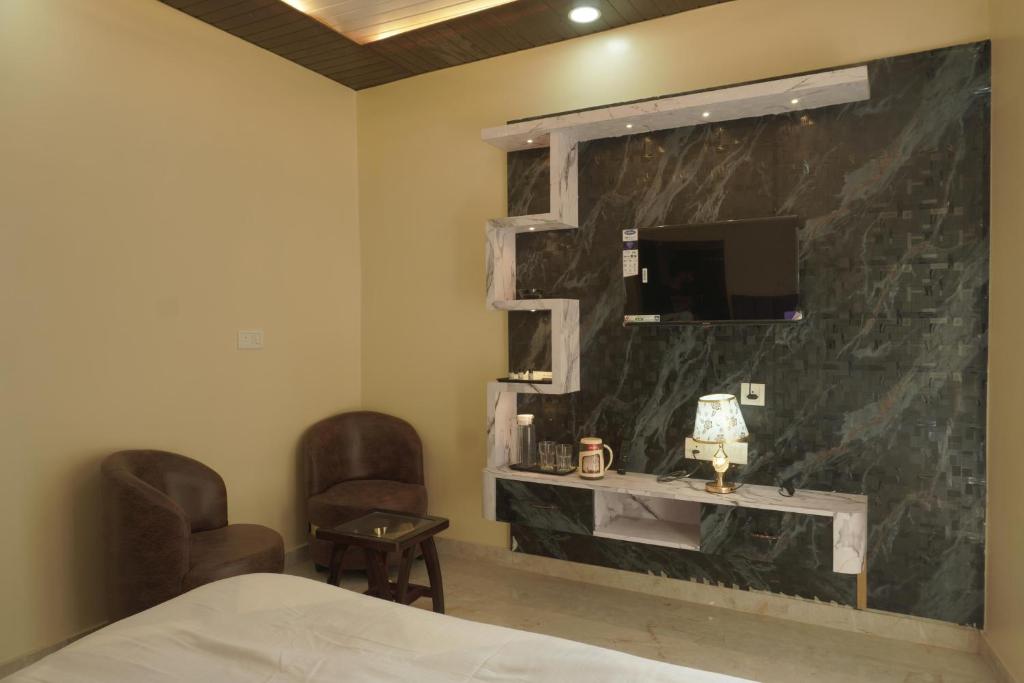 TV a/nebo společenská místnost v ubytování Classy5 Guest House