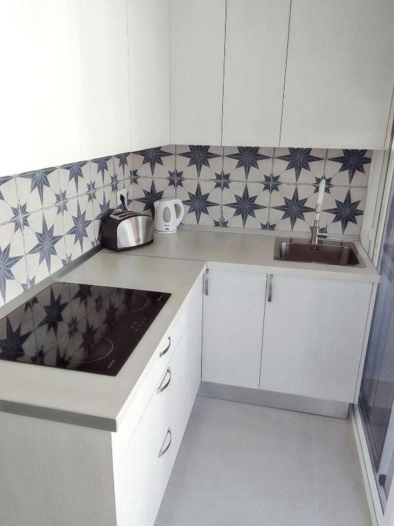 Kuchyň nebo kuchyňský kout v ubytování Comfortable Apartment in Arona, 50 m², Shared Pool
