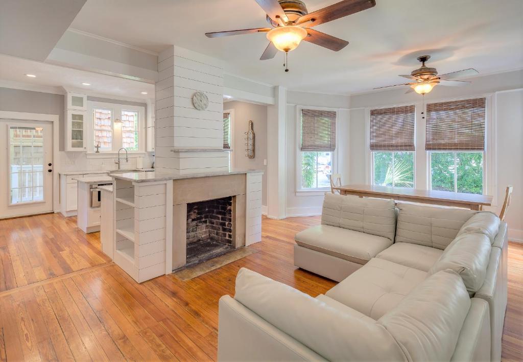 a living room with a couch and a fireplace at Historic Lady Renovated-Half Mile Walk to DT-Beach 3 Mi-Optional Guesthouse in Saint Augustine