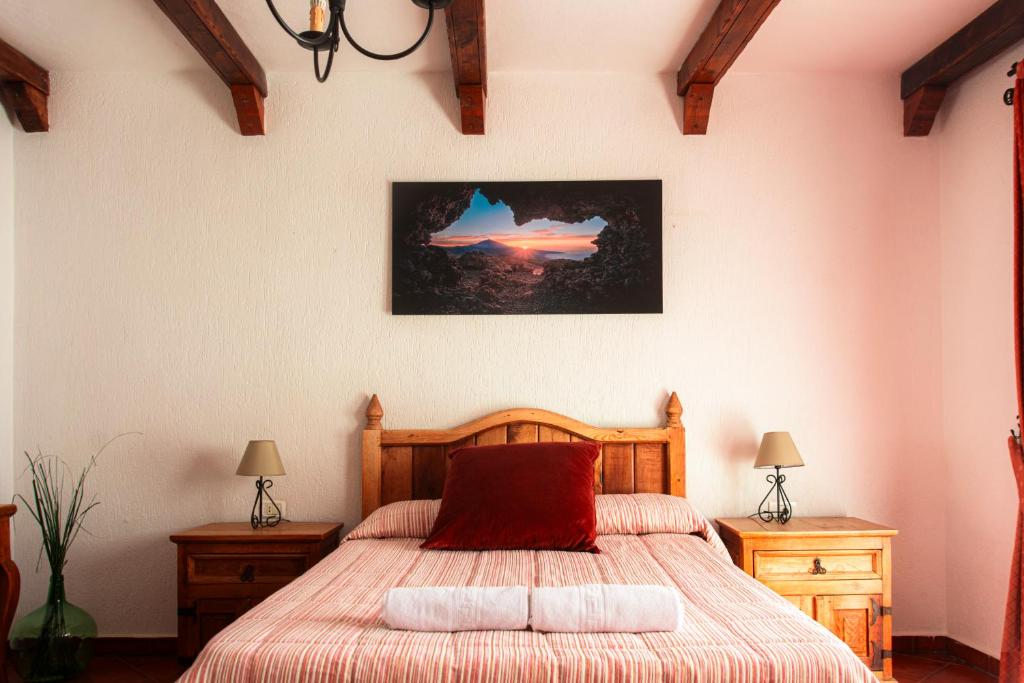 Posteľ alebo postele v izbe v ubytovaní Hotel Las Cañadas