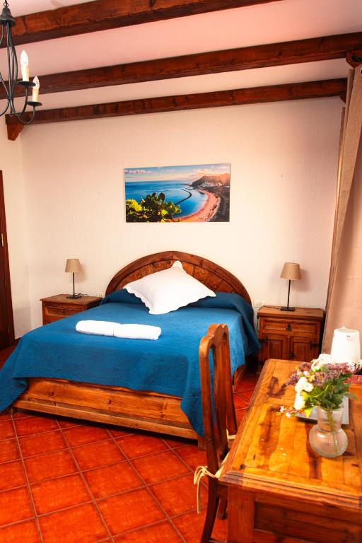 Posteľ alebo postele v izbe v ubytovaní Hotel Las Cañadas