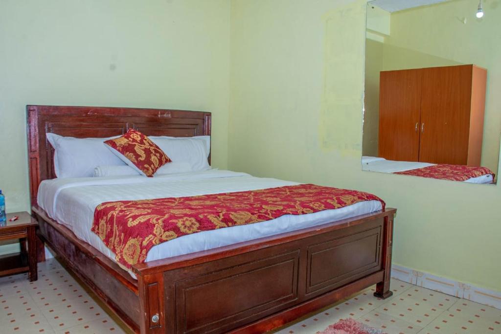 Postel nebo postele na pokoji v ubytování Lyntex guest house