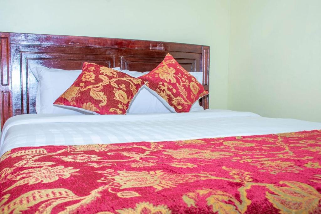 Postel nebo postele na pokoji v ubytování Lyntex guest house