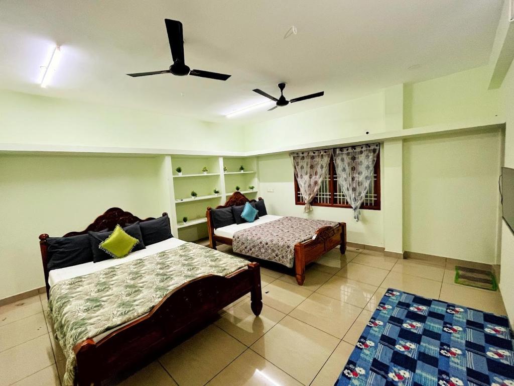Postel nebo postele na pokoji v ubytování Shivam Eden Beach Homestay