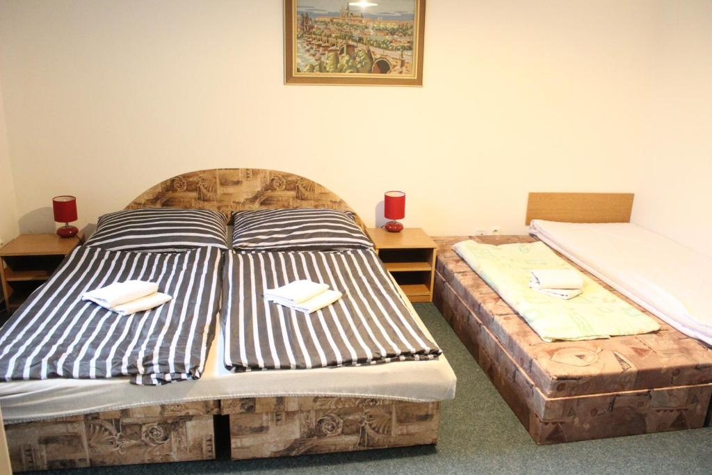 Postel nebo postele na pokoji v ubytování Penzion Sorbon