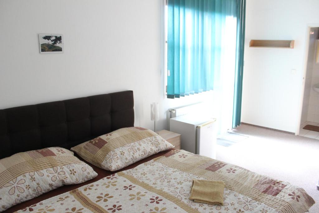 Postel nebo postele na pokoji v ubytování Penzion Sorbon