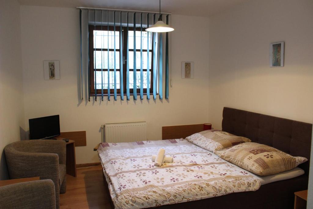 Postel nebo postele na pokoji v ubytování Penzion Sorbon