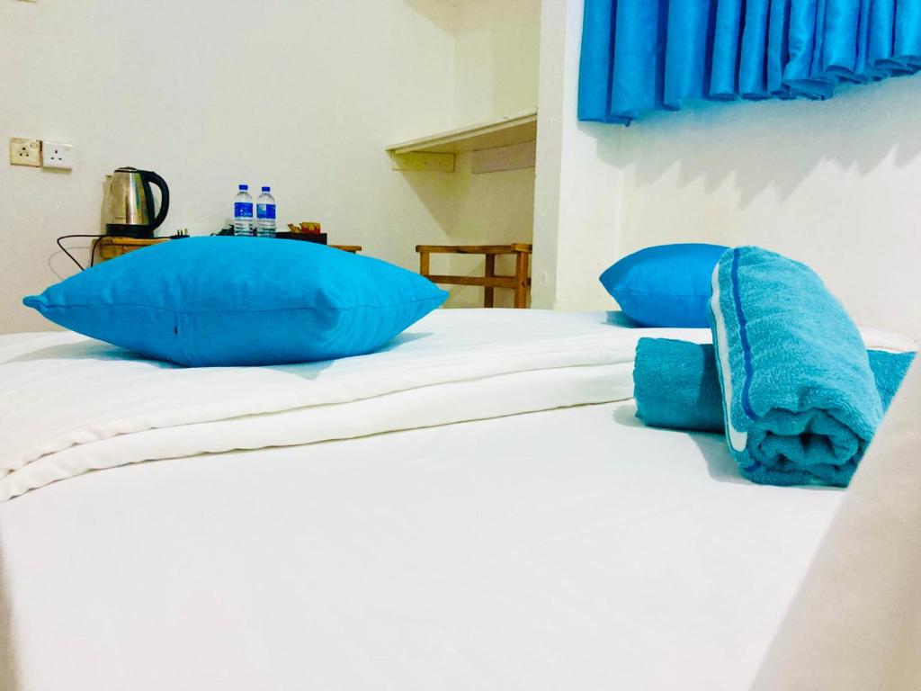 Postel nebo postele na pokoji v ubytování Memo's Inn