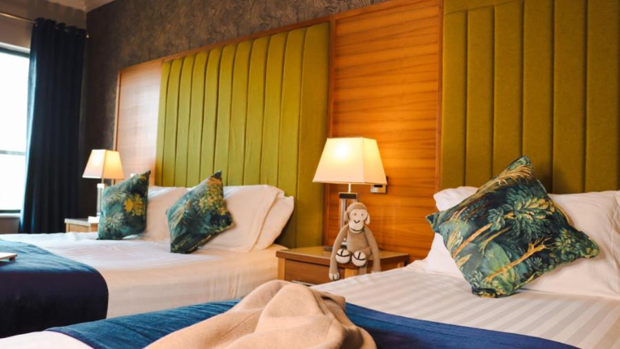 Postel nebo postele na pokoji v ubytování Amber Springs Hotel