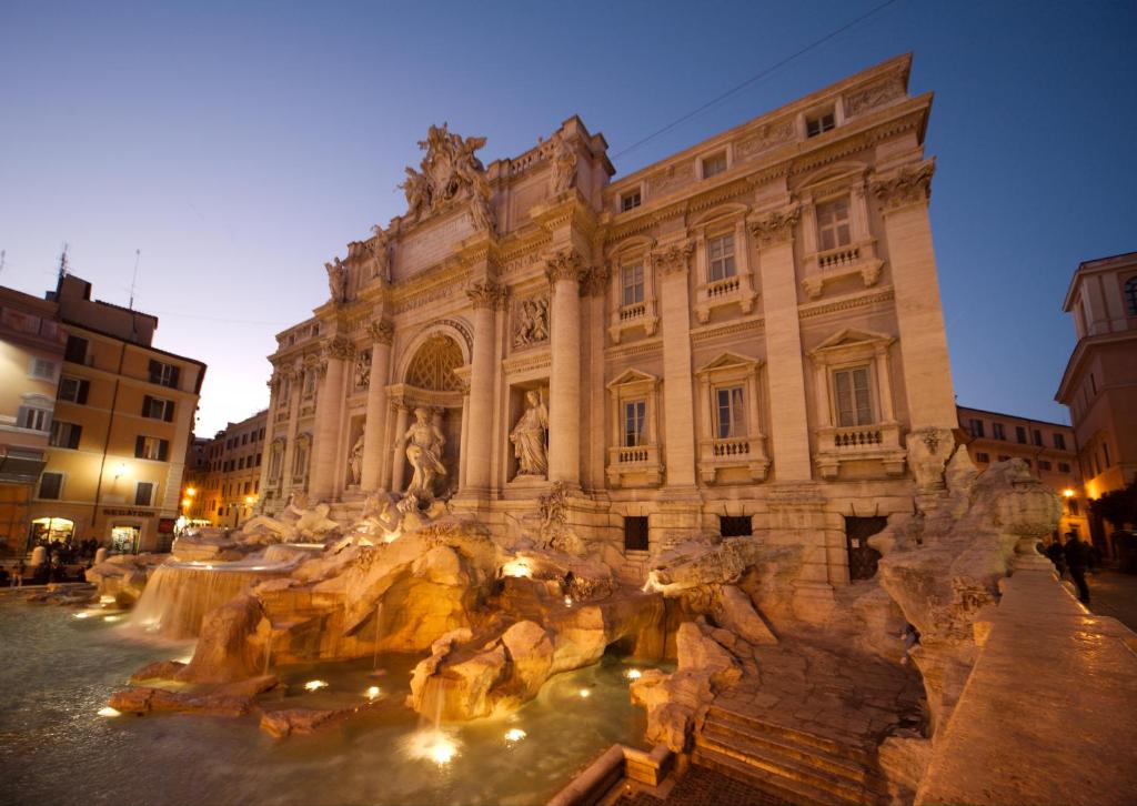 a view of the trevi fountain in front of a building at Prinsi Apartments in Rome