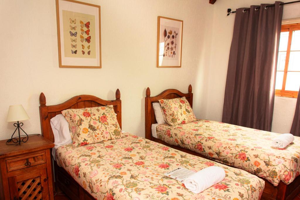 Posteľ alebo postele v izbe v ubytovaní Hotel Las Cañadas