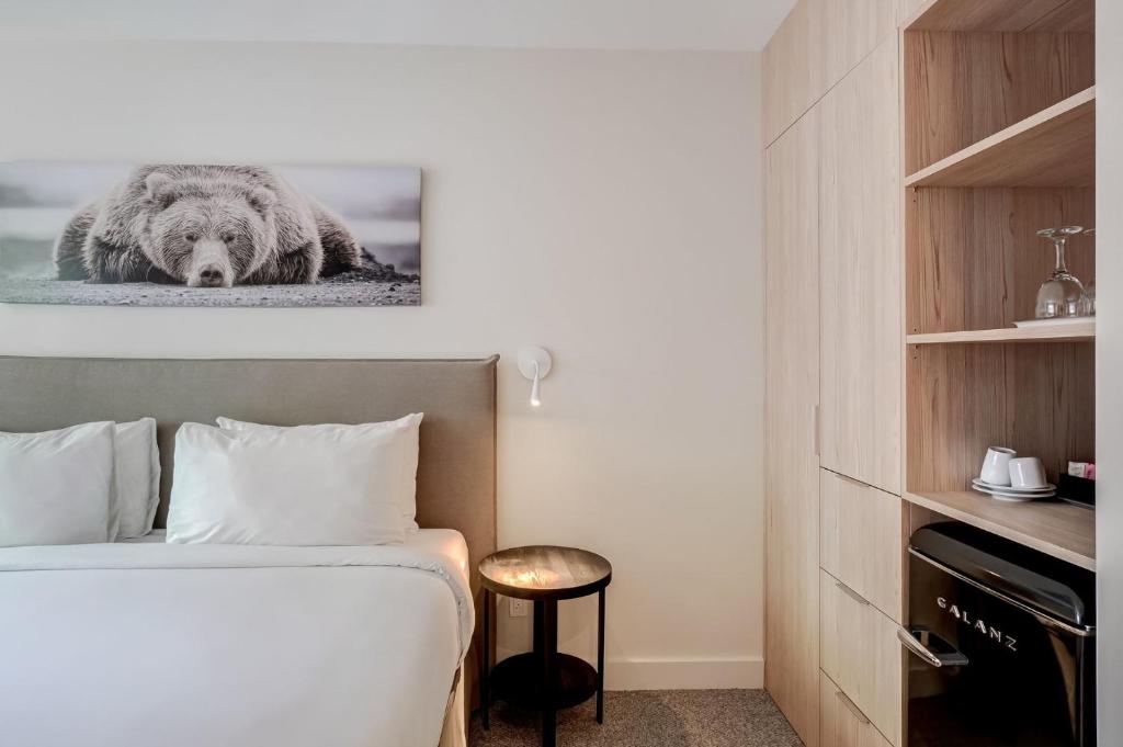 Postel nebo postele na pokoji v ubytování Suites du Lac Moore