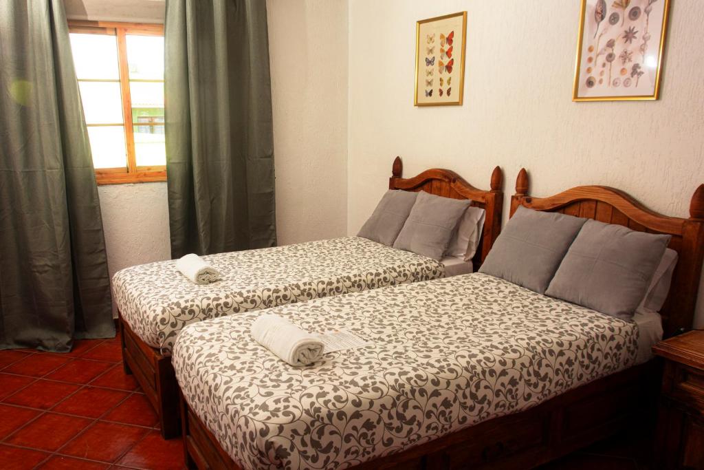 Posteľ alebo postele v izbe v ubytovaní Hotel Las Cañadas