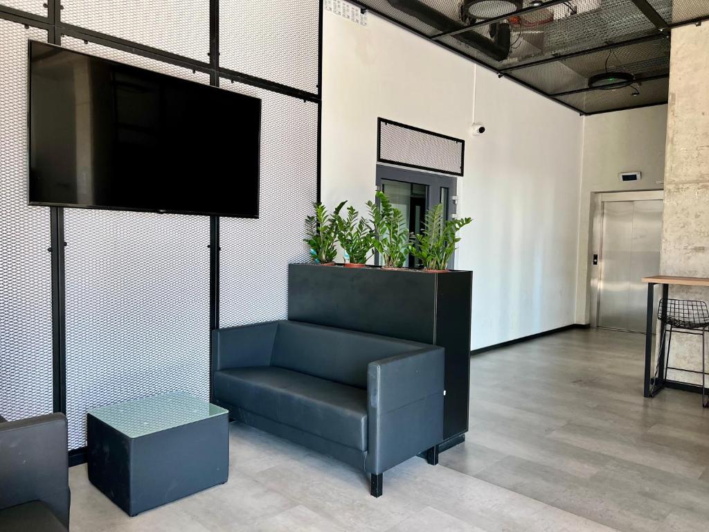 TV a/nebo společenská místnost v ubytování Legnicka Business Apartments