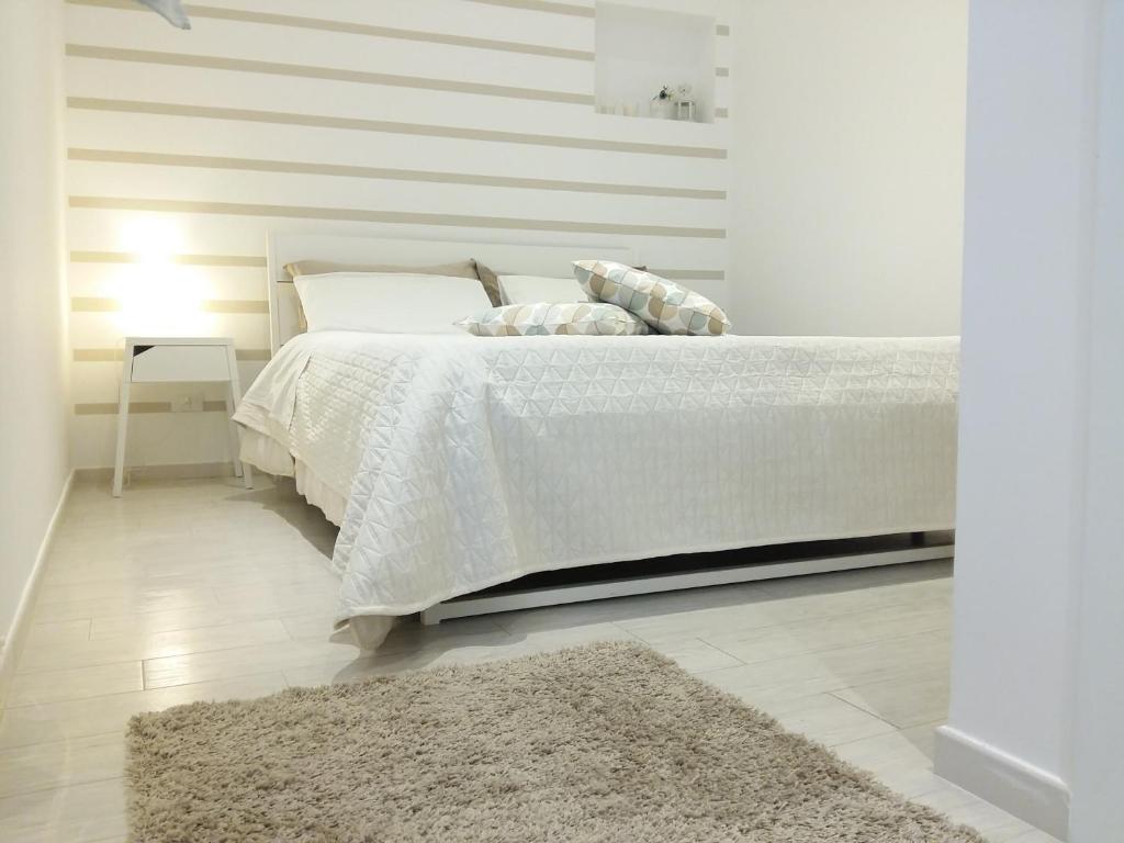 Postel nebo postele na pokoji v ubytování Appartamenti e Camere Silva Trapani