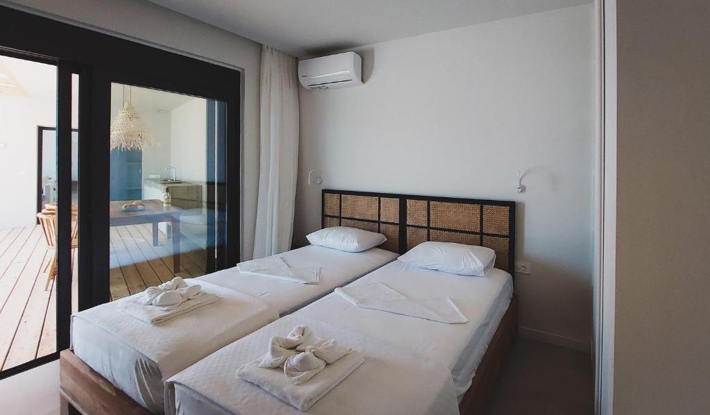 Ένα ή περισσότερα κρεβάτια σε δωμάτιο στο Nea Gi