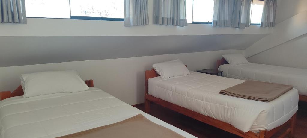 Ένα ή περισσότερα κρεβάτια σε δωμάτιο στο Anata Hotel