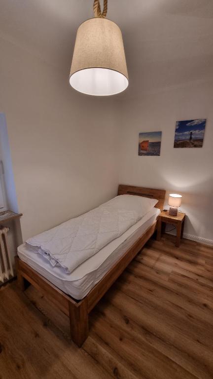 Postel nebo postele na pokoji v ubytování OSTSEE FeWo by Wolf