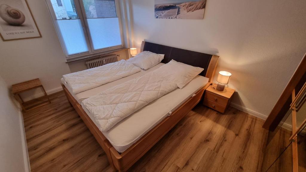 Postel nebo postele na pokoji v ubytování OSTSEE FeWo by Wolf