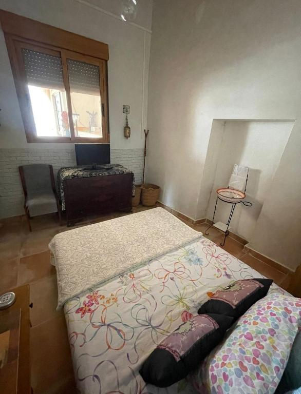 Postel nebo postele na pokoji v ubytování Cortijo de la montaña