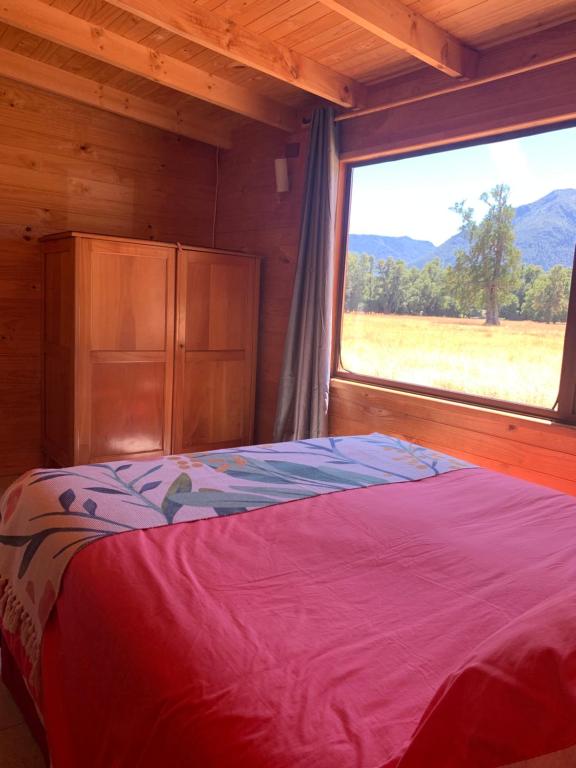 Ένα ή περισσότερα κρεβάτια σε δωμάτιο στο Hostal Tour Pucon