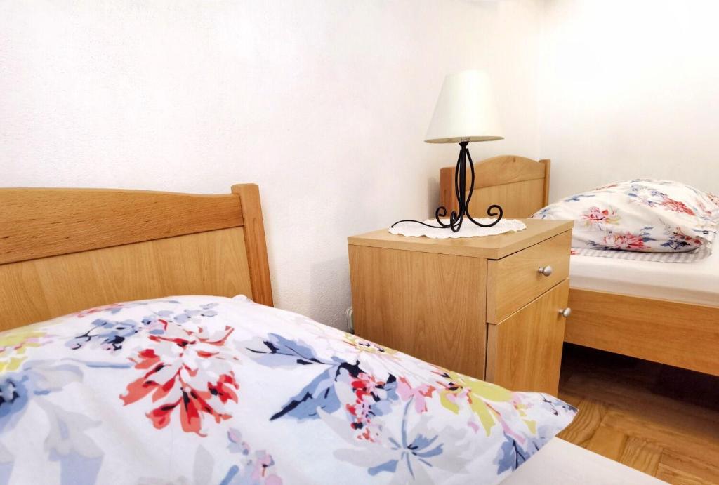 Posteľ alebo postele v izbe v ubytovaní Apartments Branka