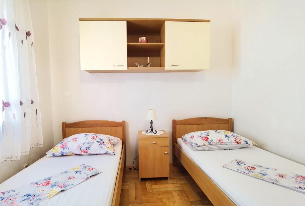Posteľ alebo postele v izbe v ubytovaní Apartments Branka