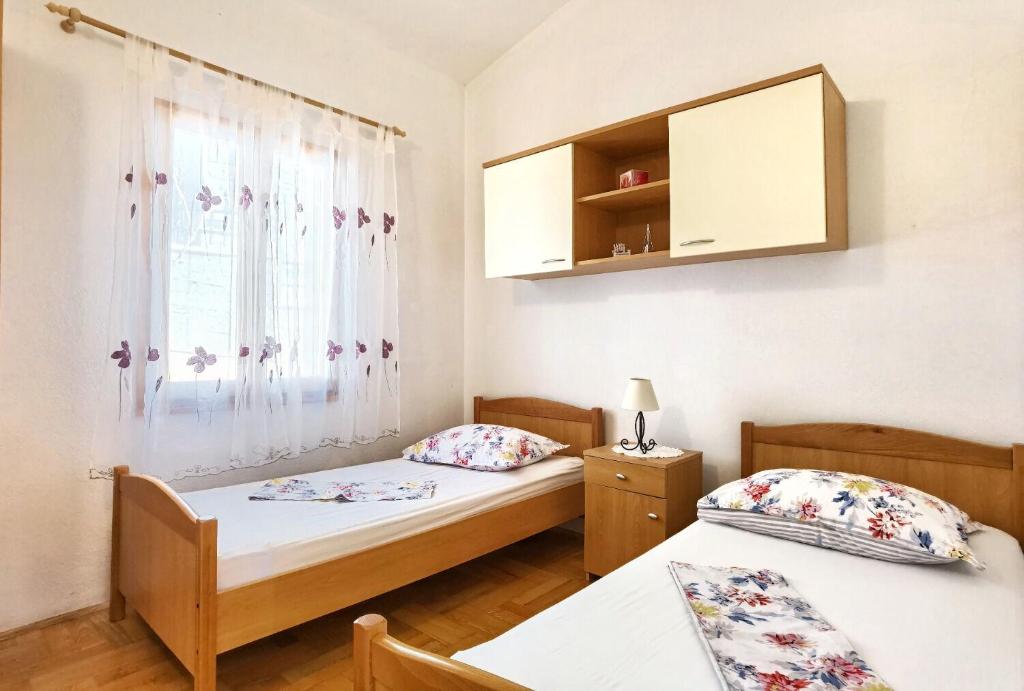 Posteľ alebo postele v izbe v ubytovaní Apartments Branka