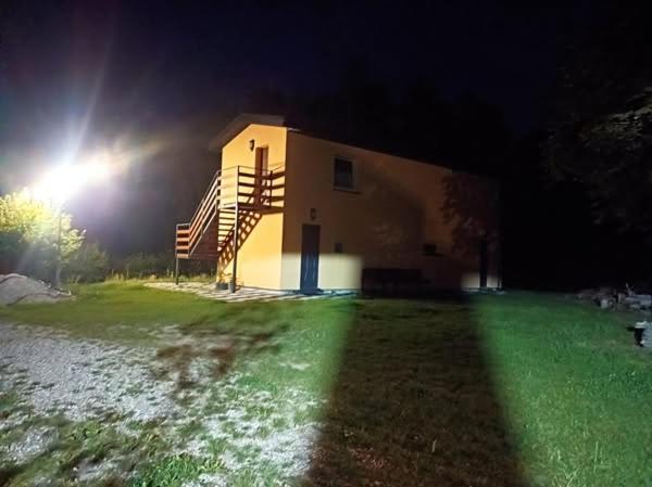 a building with a staircase next to it at night at Borówkowa Agroturystyka Nad Morzem in Darłowo