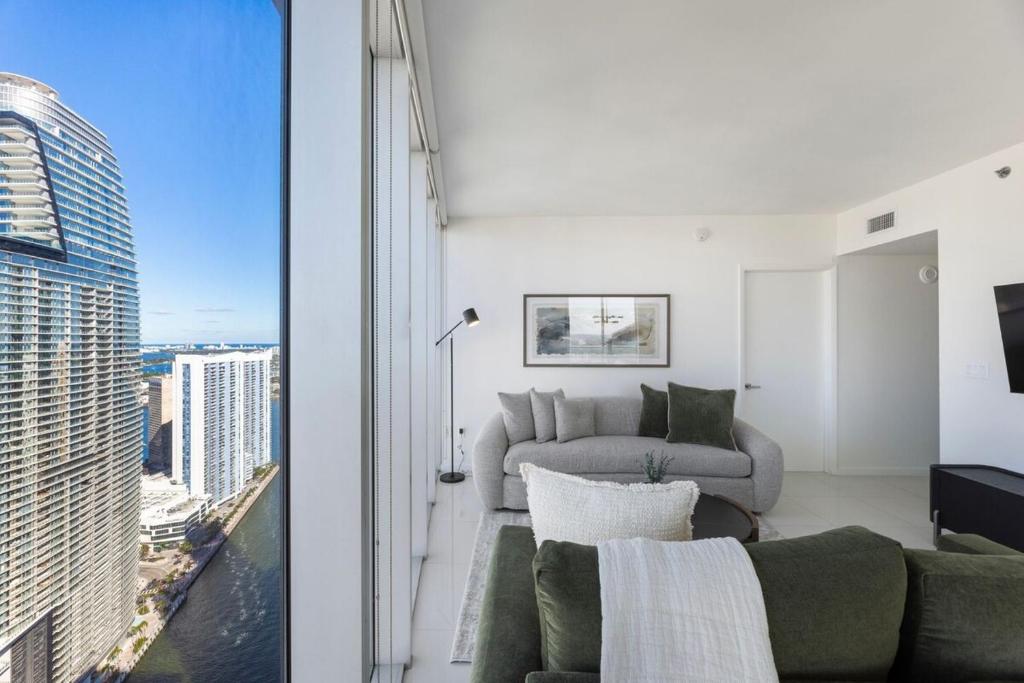 a living room with a view of the city at Sky High Penthouse Corner 2BR 2BA Icon Brickell in Miami